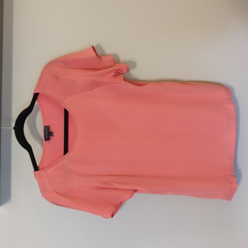The limited peach colored top